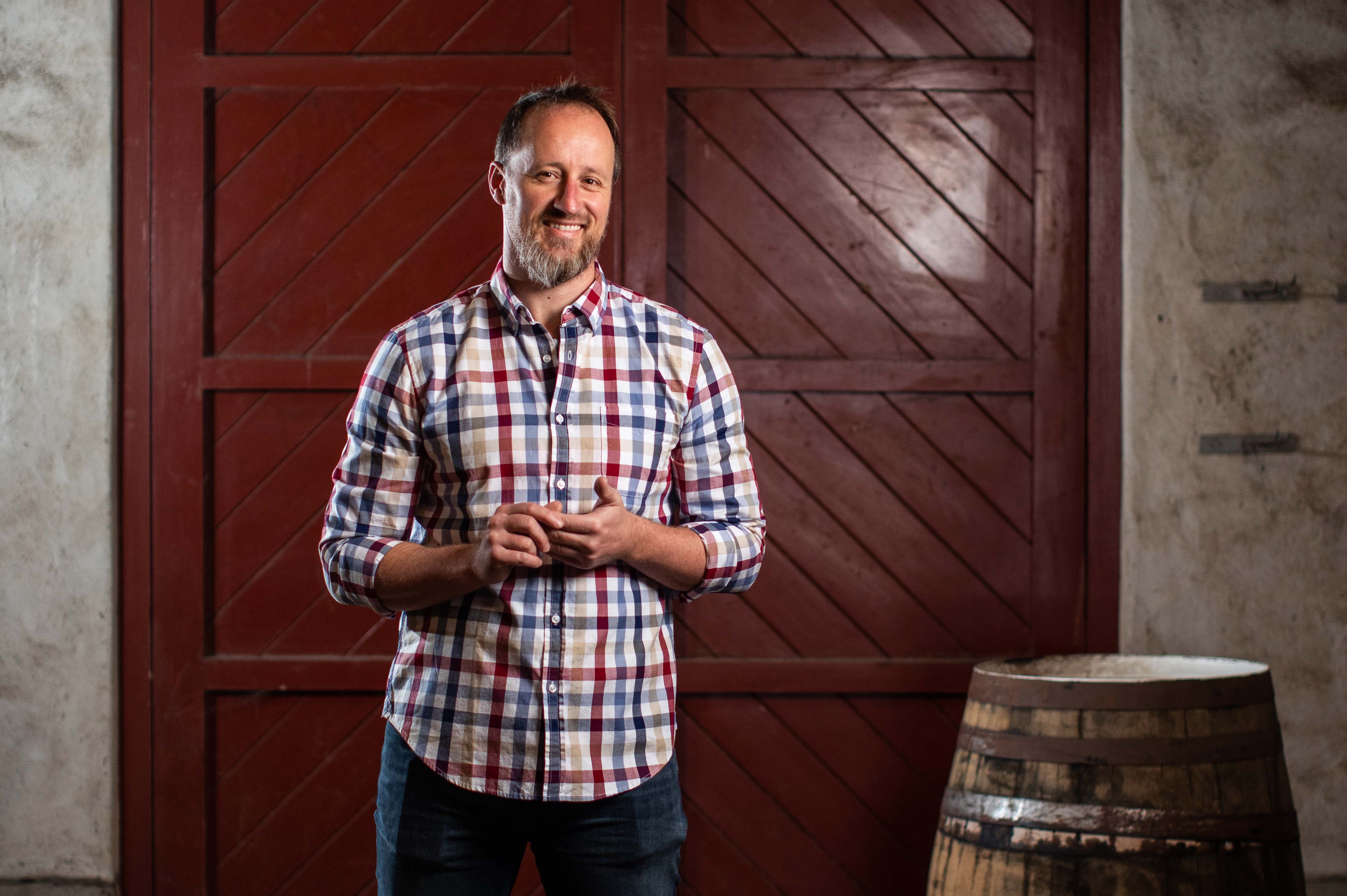 A man posing  at the Running With Bulls winery